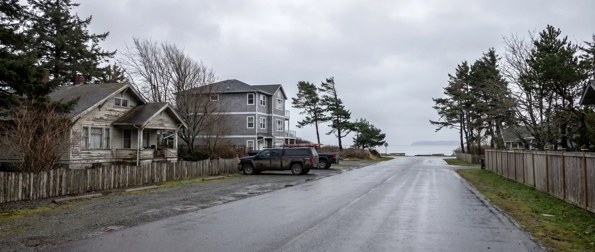 Coastal street of cottages and second homes in Blaine with the bay at the end of it